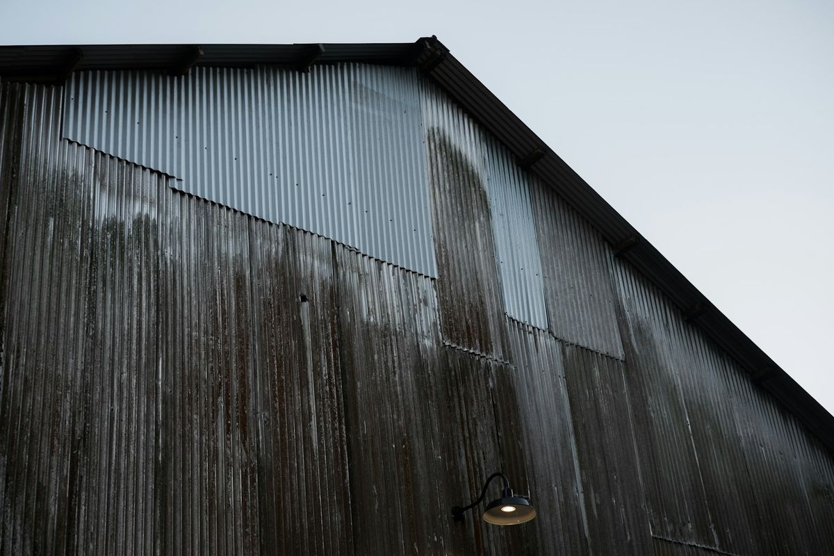A corrugated metal shed wall in the cold